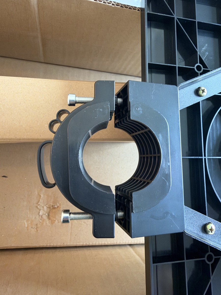 Shelf collar closed: front half seated against the rear half with both bolts passing through into the bracket